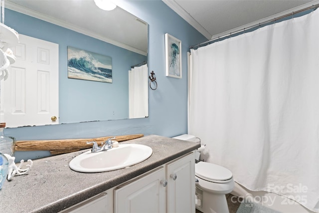 bathroom featuring toilet, vanity, and ornamental molding