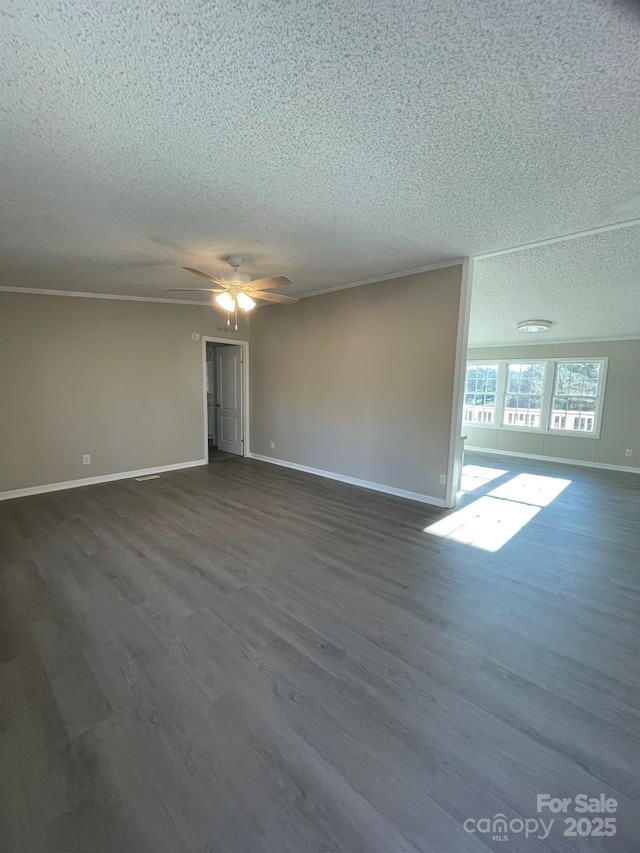 spare room featuring ceiling fan, ornamental molding, dark hardwood / wood-style floors, and a textured ceiling