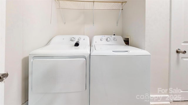 washroom with separate washer and dryer