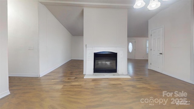 unfurnished living room with dark hardwood / wood-style floors