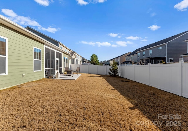 view of yard with a patio area and a sunroom