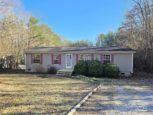 ranch-style home with a front lawn