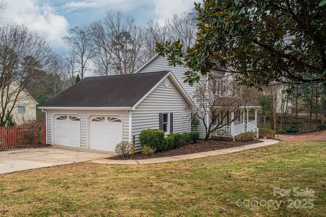 view of front of property with a front yard and a garage