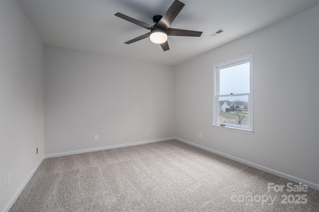 carpeted empty room featuring ceiling fan