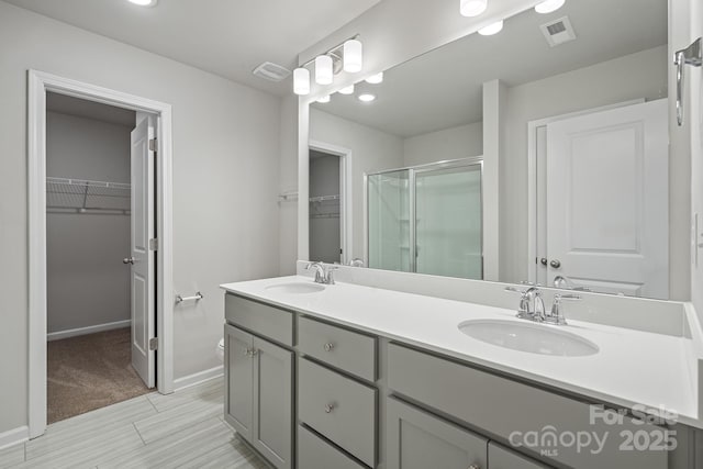 bathroom with vanity and walk in shower