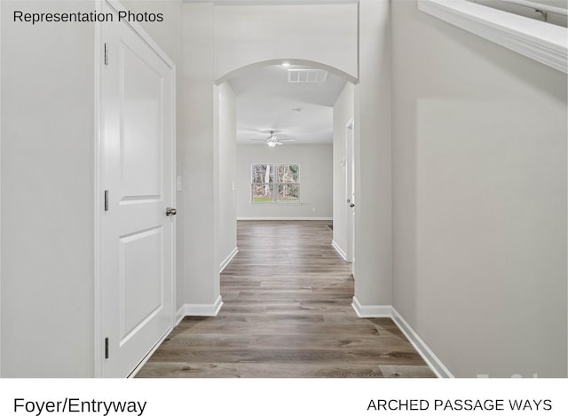 hall with hardwood / wood-style flooring