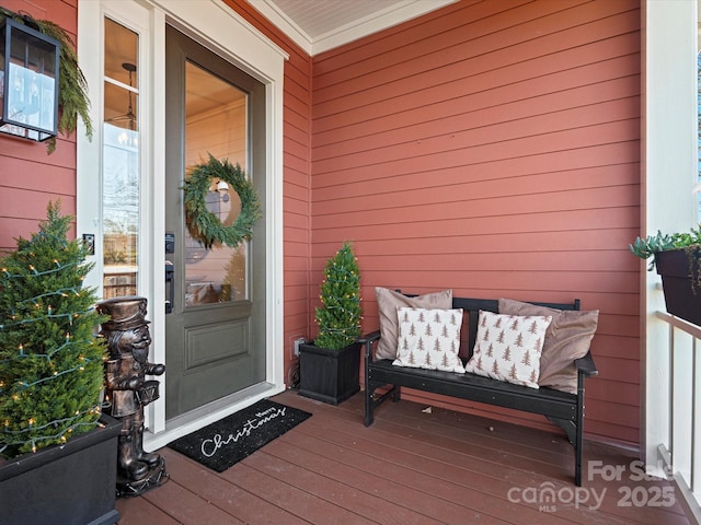 doorway to property featuring covered porch