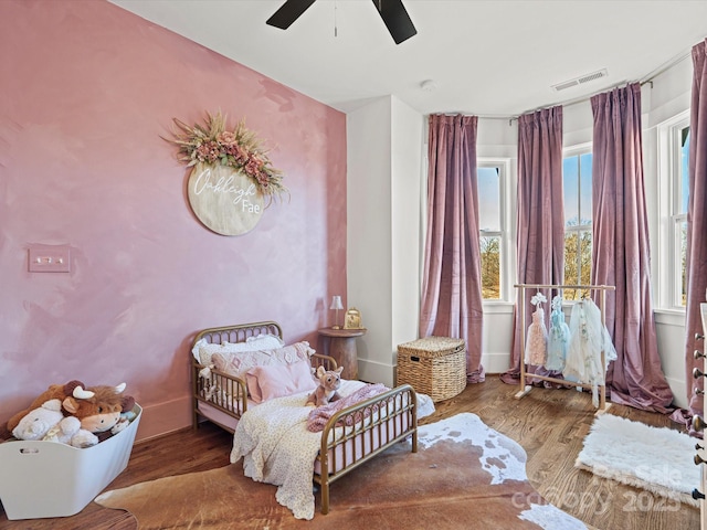 bedroom with hardwood / wood-style flooring and ceiling fan