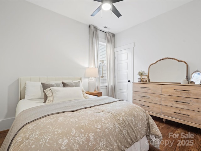 bedroom featuring ceiling fan and dark hardwood / wood-style floors