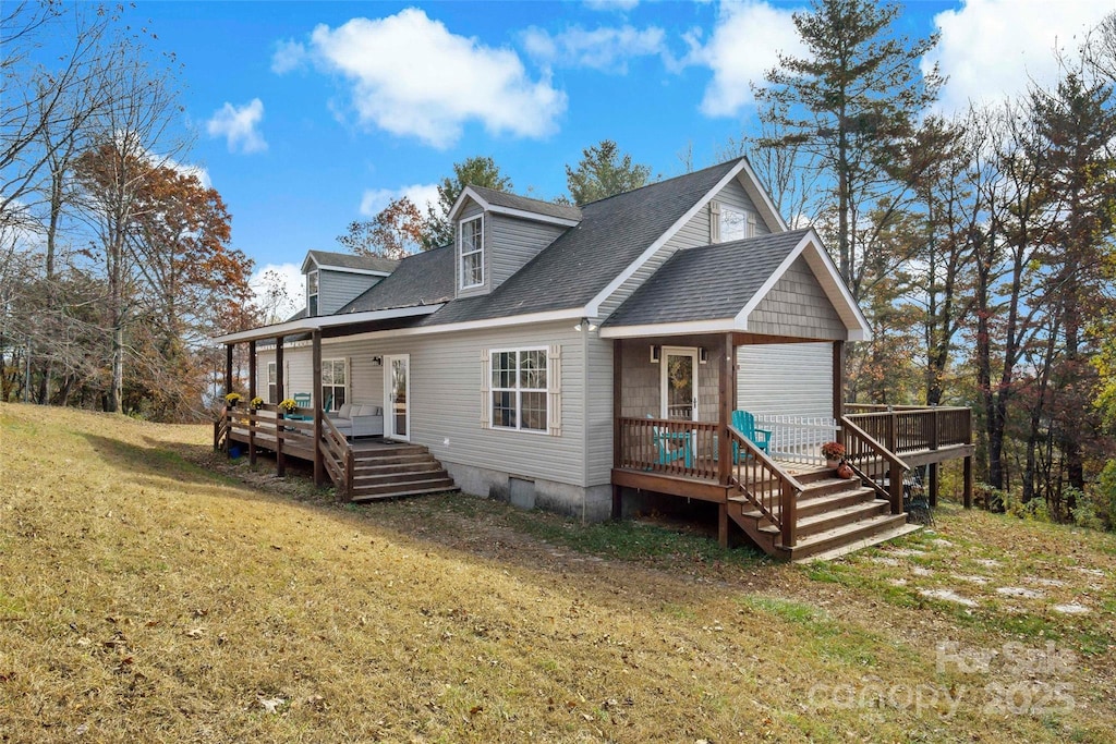 rear view of house with a yard