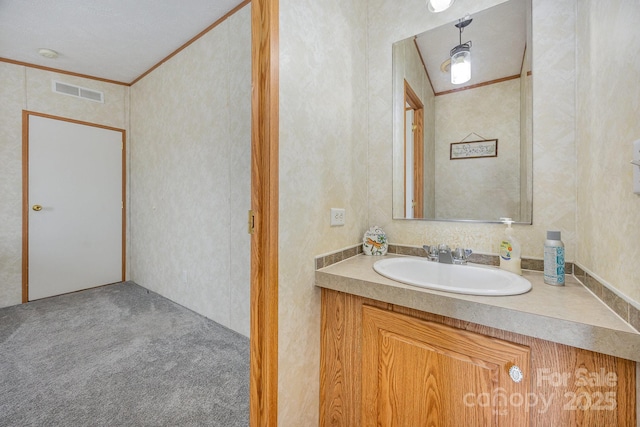 bathroom featuring vanity and crown molding