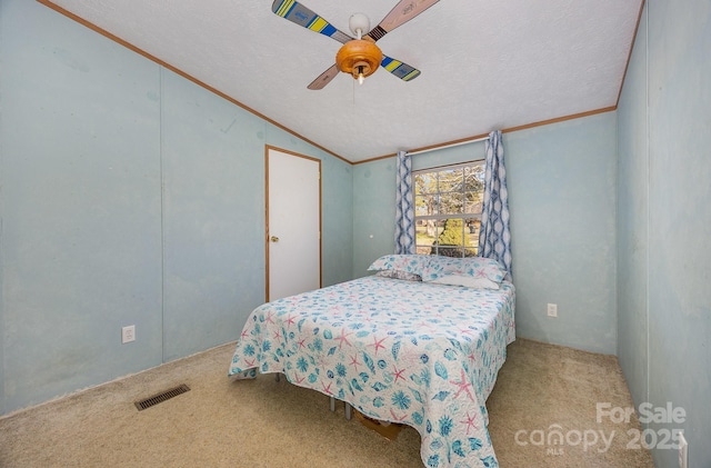 bedroom with ceiling fan, light colored carpet, vaulted ceiling, and a textured ceiling