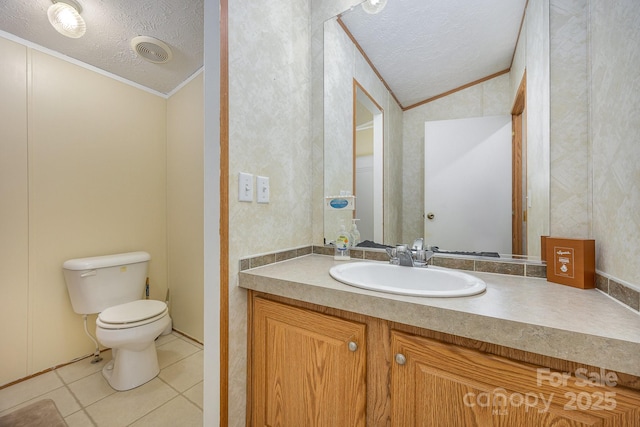 bathroom with a textured ceiling, vaulted ceiling, tile patterned floors, and ornamental molding