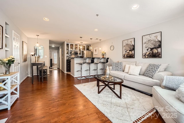 living room with dark hardwood / wood-style flooring