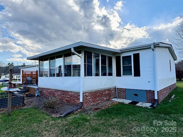 view of home's exterior featuring a sunroom