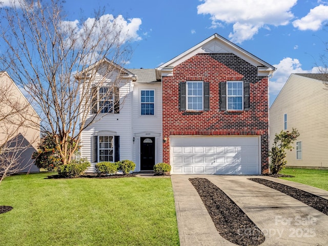 view of front of property with a front lawn and a garage