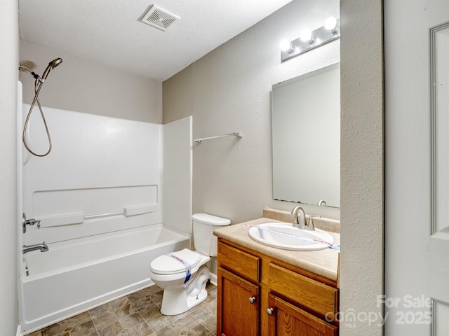 bathroom featuring shower / bath combination, visible vents, toilet, vanity, and a textured ceiling