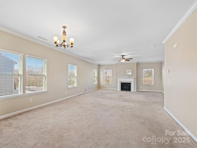 unfurnished living room featuring crown molding, ceiling fan with notable chandelier, and light colored carpet