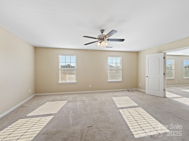 empty room with ceiling fan and light colored carpet