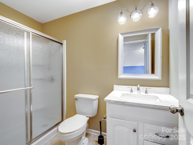 bathroom with vanity, toilet, and an enclosed shower