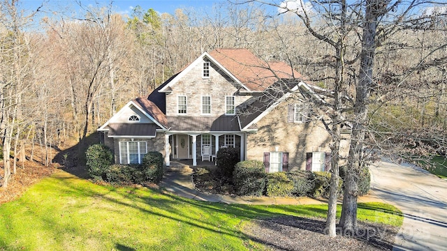 front of property with a front lawn and a porch