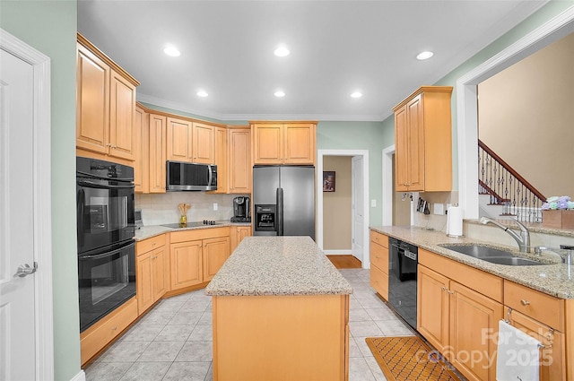 kitchen featuring light tile patterned floors, decorative backsplash, a kitchen island, a sink, and black appliances