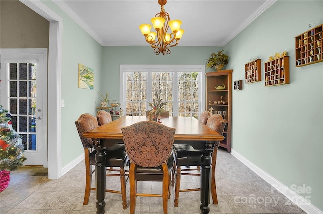 dining space featuring ornamental molding, a chandelier, light tile patterned flooring, and baseboards