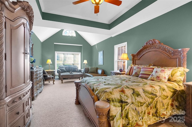 carpeted bedroom with ornamental molding, vaulted ceiling, and a ceiling fan