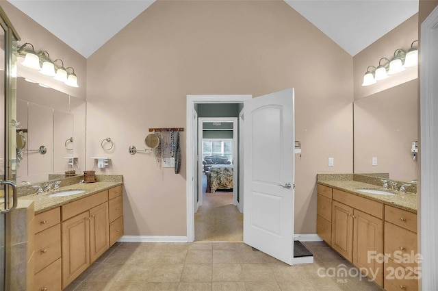 full bath with two vanities, a sink, and tile patterned floors