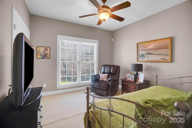 bedroom featuring a ceiling fan, baseboards, and carpet flooring