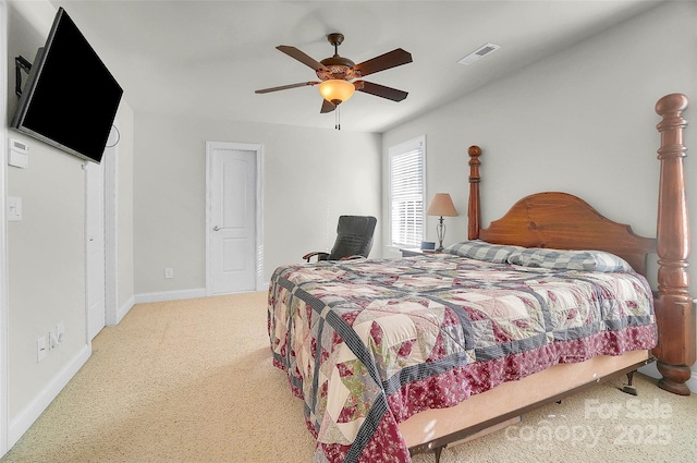 bedroom with carpet floors, visible vents, baseboards, and a ceiling fan