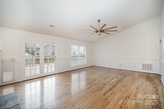 spare room with ceiling fan, light hardwood / wood-style flooring, and lofted ceiling