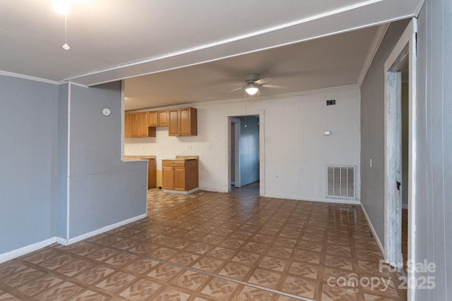 unfurnished living room with ceiling fan, crown molding, and light parquet flooring