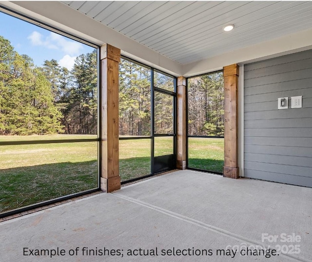 unfurnished sunroom with plenty of natural light