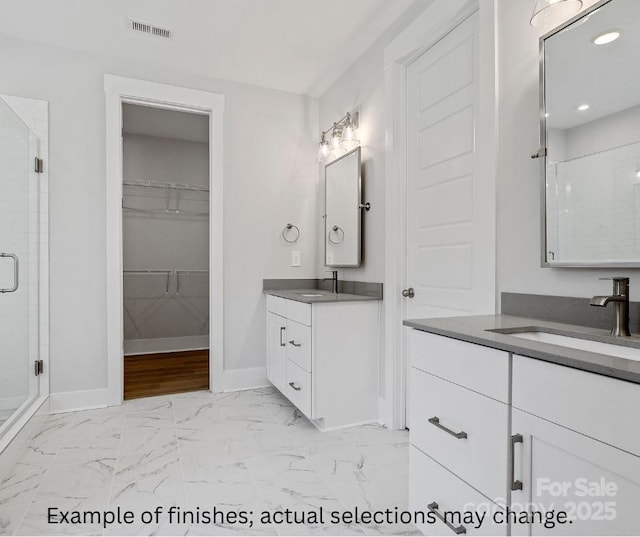 bathroom with vanity and walk in shower