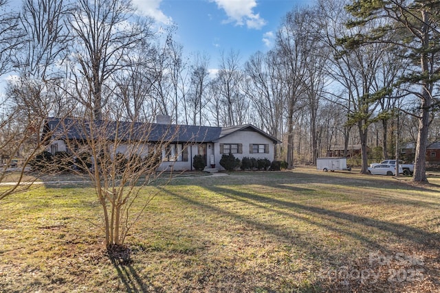 ranch-style home featuring a front yard