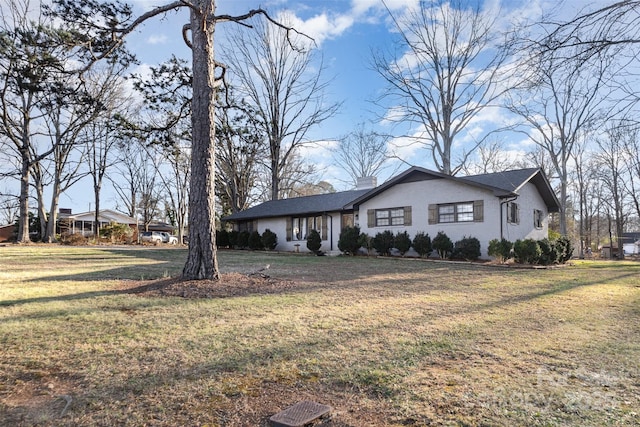 view of front of property with a front lawn