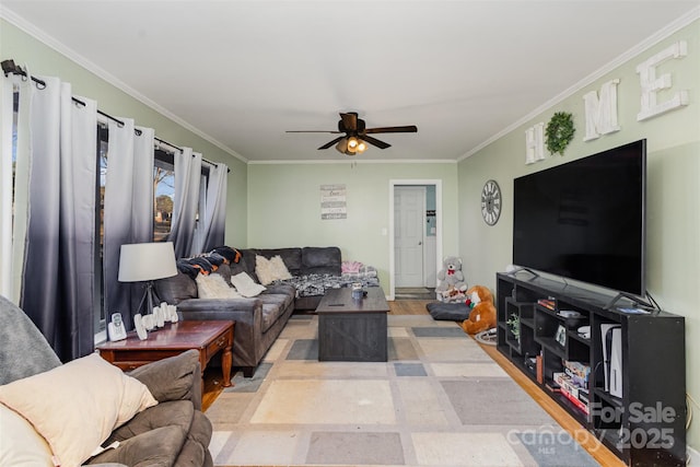 living room featuring ceiling fan and crown molding