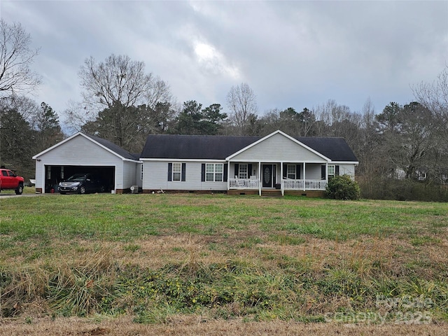 ranch-style house with an outbuilding, a front lawn, a porch, and a garage