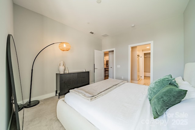 bedroom with light colored carpet