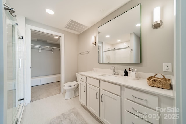 bathroom with vanity, an enclosed shower, and toilet