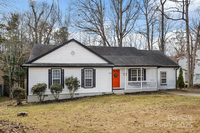 ranch-style home with a front yard and a porch