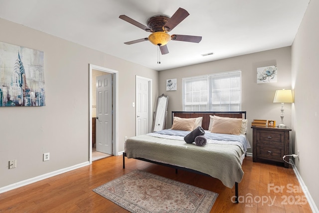 bedroom with ceiling fan and light hardwood / wood-style flooring