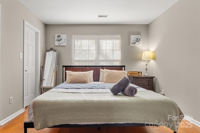 bedroom with light hardwood / wood-style flooring