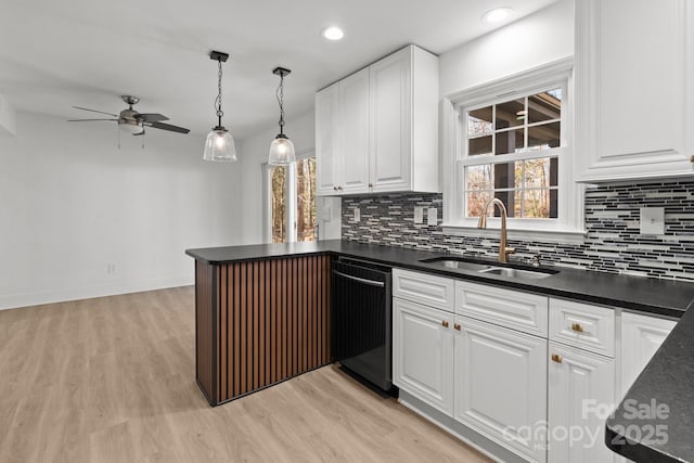 kitchen featuring dishwasher, light hardwood / wood-style floors, white cabinetry, and sink