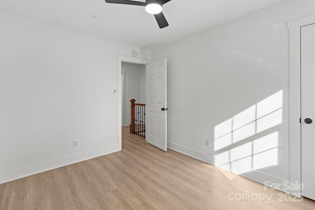 spare room featuring ceiling fan and light wood-type flooring