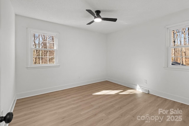 unfurnished room featuring ceiling fan and light wood-type flooring