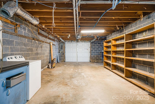 garage with washer / clothes dryer and a garage door opener