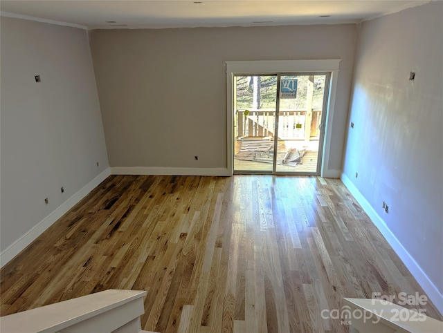 spare room featuring light hardwood / wood-style floors