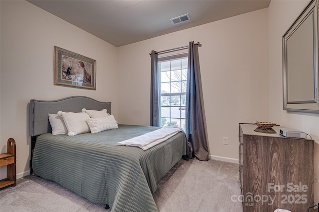 bedroom with light colored carpet